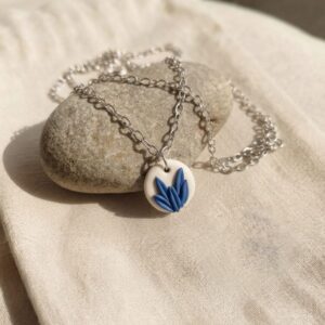 handmade blue floral clay pendant